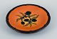 Ipsens, 
Denmark, 
ceramic bowl 
with floral 
motif.
Glaze in 
orange-green 
shades.
1920s.
In ...
