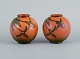 Ipsen's, 
Denmark. Two 
small vases 
with glaze in 
orange-green 
shades.
Model number 
...