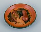 Ipsen's, 
Denmark. Bowl 
with leaves and 
pumpkins, glaze 
in shades of 
orange-green.
Model ...