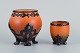 Ipsen's widow. 
Two small vases 
with glaze in 
orange-green 
shades.
Model numbers 
740 and ...