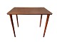 Small table in teak veneer with slightly conical legs in solid teak wood. Danish modern from the ...