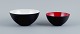 Two "krenits" 
bowls in metal.
White and red.
Design by 
Hermann 
Krenchel.
2000s.
In perfect ...