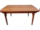 Dining table in teak veneer with solid teak legs and extension, as well as inclined braces for ...