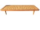 Daybed in teak wood veneer with solid teak legs. Has some age-related signs of use. Dimensions: ...
