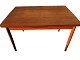 Dining table in teak veneer with solid teak legs. pull-out plates. Danish modern from the 1960s. ...