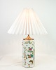 A few of Chinese table lamps in porcelain with motifs of nature from the 1920s. Stands in fine ...