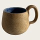 Ceramic mug, 
Signed: Tove 
75. With blue 
glaze inside, 
13cm wide, 8cm 
high *Nice 
condition*