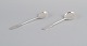 Evald Nielsen, Danish silversmith, two hammered sugar spoons in Danish 830 silver. One spoon ...