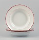Meissen, three deep plates with orange-red decoration.Early 20th century.Marked.In ...