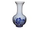 Royal Copenhagen small vase with blue flowers.The factory mark tells, that this was produced ...