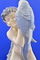 Royal Copenhagen porcelain. Royal Copenhagen figurine, Faun with parrot no. 752. Height 18 cm. 7 ...