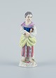Meissen, Germany, porcelain figure. Overglaze.Young woman with book.Model number: ...