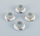 Royal 
Copenhagen, 
Saxon Flower.
A set of four 
salt jars, hand 
painted with 
flowers and 
gold ...