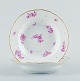 Royal 
Copenhagen, two 
deep plates 
hand painted 
with purple 
flowers and 
gold rim.
Approx. ...