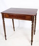 Mahogany side table with drawer in the middle and round legs from around the ...