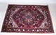 A real Persian 
rug made by 
hand patterned 
and dyed with 
reddish colors.
Measurements 
in cm: ...
