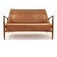 Ib Kofod-Larsen "The Seal" two seater sofa, teak and leather, by Brdr. Petersen, DenmarkNice ...