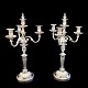 A pair of French candlesticks of silver plated bronze. Three armed candlesticks on round bases. ...
