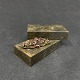 Length 4.5 cm.
Oval brooch 
with numerous 
ground garnets 
mounted in 
gilded brass.
It is in ...