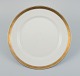 Royal 
Copenhagen no. 
607. Round 
serving dish in 
porcelain.
Gold border 
with foliage.
Model ...