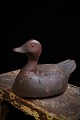 Decorative, old 
decoy in 
painted wood 
with glass eyes 
and with a fine 
patina. H:16 
cm. L:29 cm.