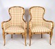 A pair of two armchairs in checked fabric with wooden frames from around the ...