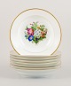 Bing & 
Grøndahl, eight 
deep plates in 
porcelain 
hand-painted 
with polychrome 
flowers and 
gold ...