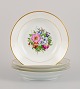 Bing & 
Grøndahl, four 
deep plates in 
porcelain 
hand-painted 
with polychrome 
flowers and 
gold ...