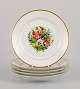 Bing & Grøndahl, five porcelain lunch plates hand-painted with polychrome 
flowers and gold decoration.