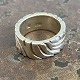 Wide sculptural ring of sterling silver. Ø 22 mm. internal dimensions 16 mm. Stamped 925s. ...