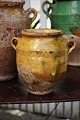 Decorative small 19th century clay jug with handle from the South of France with ocher yellow ...