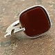 Sculptural ring of sterling silver with red stone. Internal dimensions 17 mm. Stamped 925s. ...