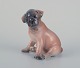 Royal 
Copenhagen, 
porcelain 
figurine of a 
boxer puppy.
Model 3169.
Approximately 
from the ...