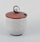 Bing & 
Grøndahl, 
marmalade jar 
in crackle 
porcelain with 
wooden lid by 
Hugo Grün, 
flower knob in 
...