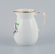 Bing & 
Grøndahl, 
porcelain jug 
decorated with 
polychrome 
flowers and a 
handle in the 
shape of a ...