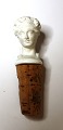 Wine cork in biscuit in the shape of a woman's bust with a cork stopper. Probably from Royal ...