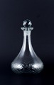 Danish glasswork, wine decanter in clear glass. Ball-shaped faceted stopper.From the ...