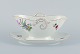 Bing & 
Grøndahl, Saxon 
Flower, a 
hand-painted 
sauce boat with 
handles shaped 
like ...