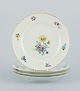 Bing & 
Grøndahl, Saxon 
Flower, a set 
of four dinner 
plates 
hand-decorated 
with polychrome 
...