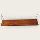 Wall-hung shelf in teak veneer. With traces of use. Dimensions: 89.5x19 cm
