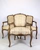 Rococo armchairs with decorated fabric in dark wood from around the 1930s. Is in very good ...