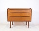 This dressing table, veneered with teak wood and manufactured by Ølholm Møbelfabrik in the ...