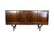 Sideboard in rosewood of Danish design with 4 sliding doors and 4 drawers from around the ...