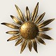Sun-shaped, gold-painted metal lamp. Diameter approx. 52 cm. Nice patinated condition.
