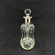 Height 15 cm.Kluk flask in clear glass with round stopper from Holmegaard.The silver ...