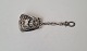 Tea Caddy spoon 
in silver 
decorated with 
ship and naked 
woman 
Stamp 830 
Length 11.5 
cm.