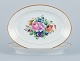 Bing & 
Grøndahl, two 
oval platters 
hand-painted 
with polychrome 
flower motifs 
and gold ...