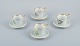 Bing & 
Grøndahl, a set 
of four antique 
coffee cups 
with high 
handles and  
saucers. 
Hand-painted 
...