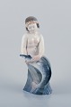 Royal 
Copenhagen, 
rare porcelain 
figurine of a 
mermaid holding 
fish in her 
hands.
Model: ...