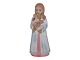 Royal 
Copenhagen 
figurine, girl 
in pink with 
doll.
This in not 
hallmarked. It 
was sold to an 
...